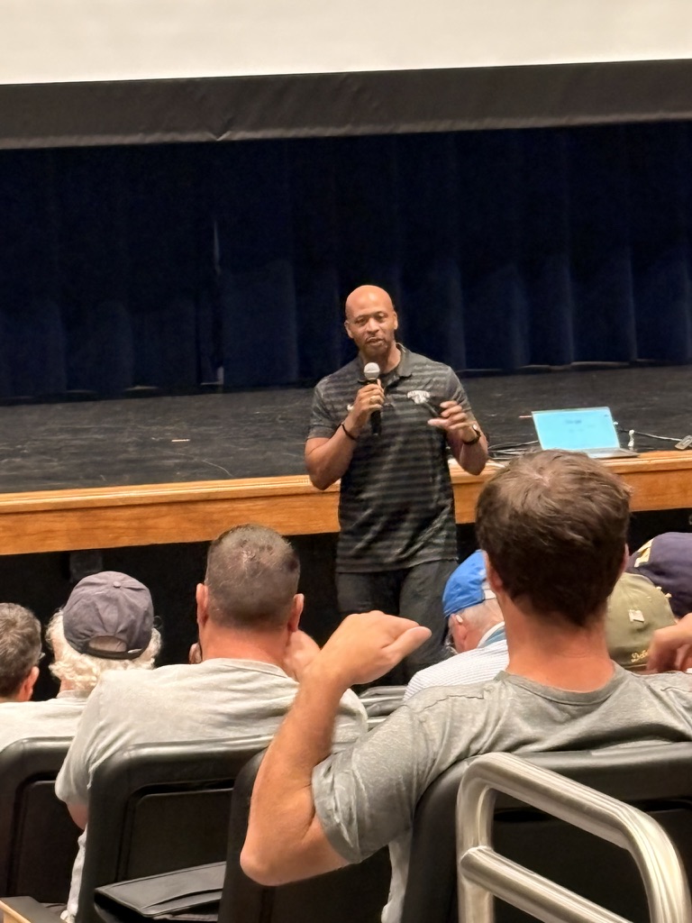Chaka Johnson speaking to an athletics audience